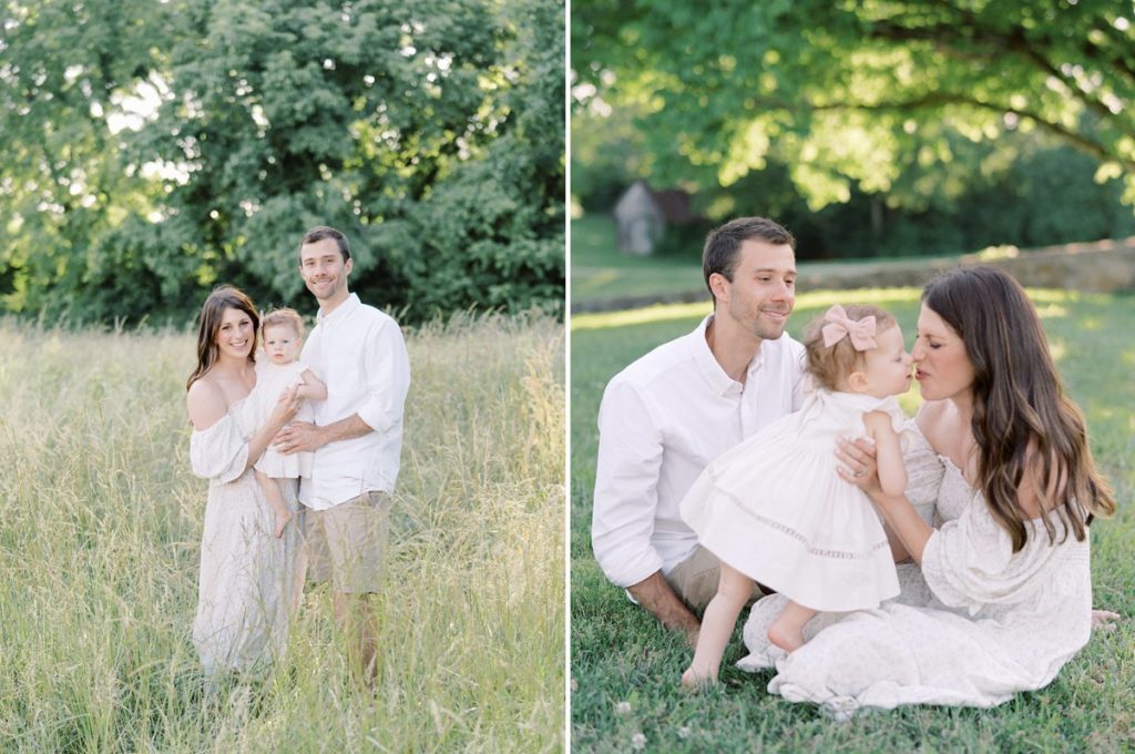 mom and dad smiling with baby girl in outdoor family session