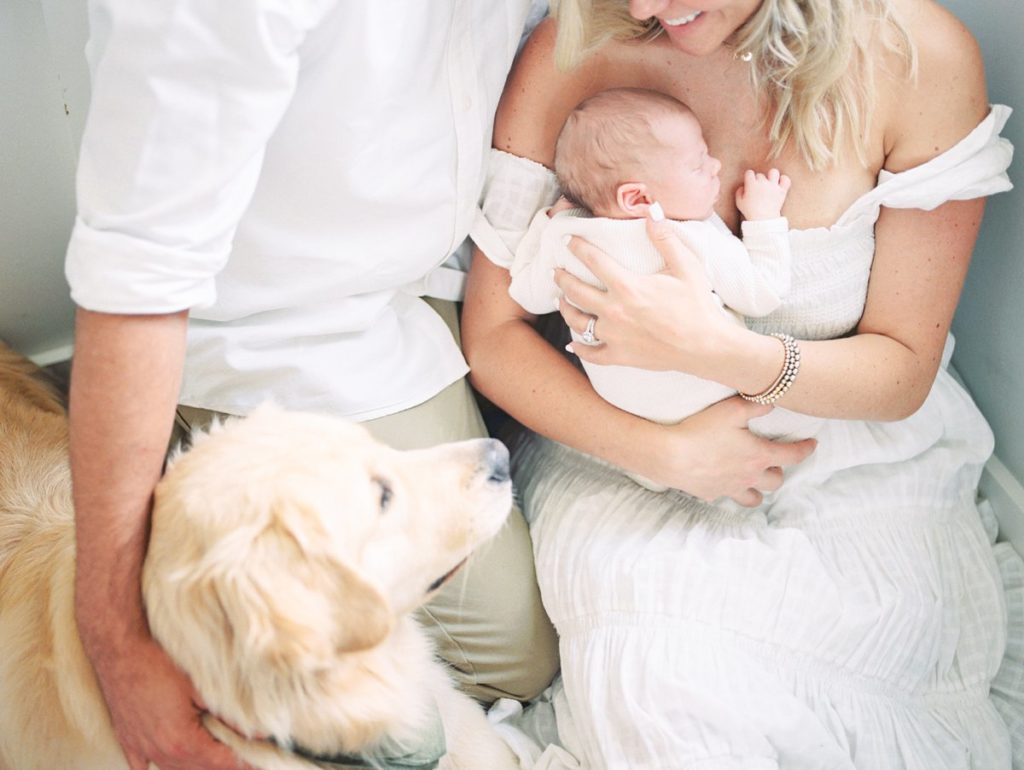 Family cuddles during in home newborn session