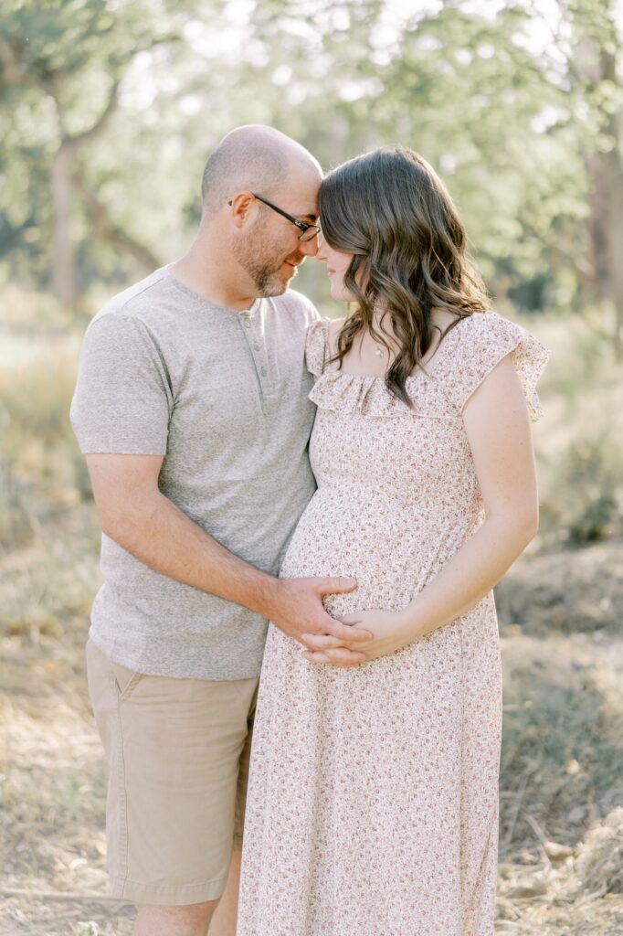 This nashville outdoor maternity session features a mother and father expecting their third baby girl