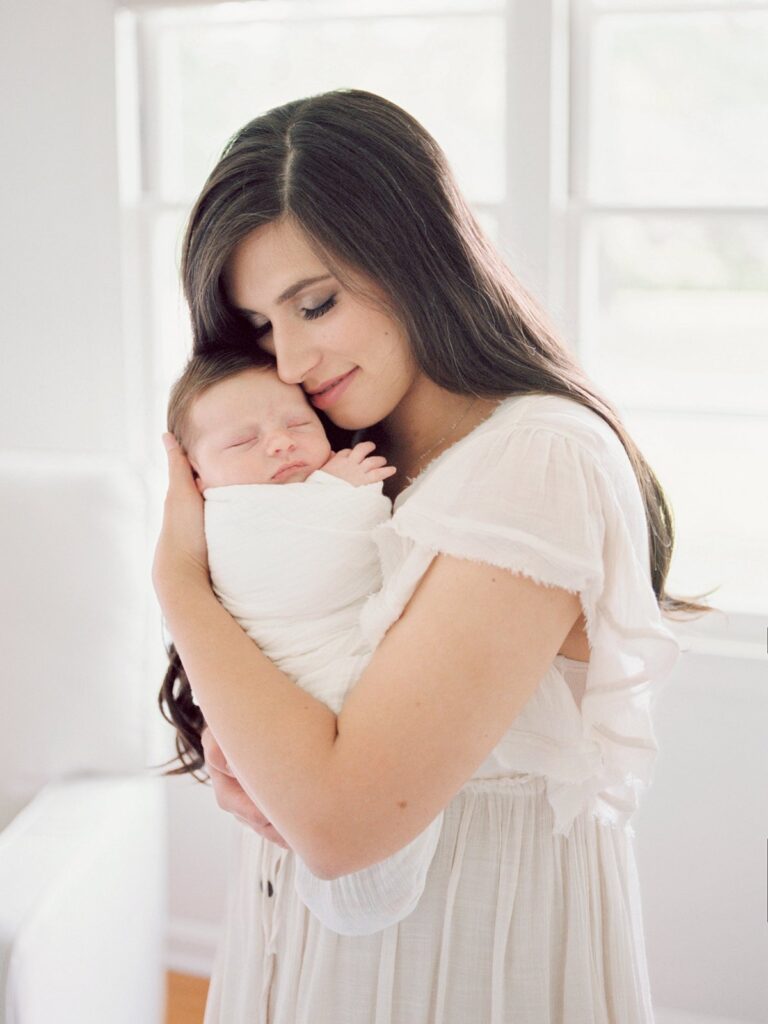 Courtney Houk captures photo of mom cuddling with her newborn baby boy in this Nashville in-home newborn session 