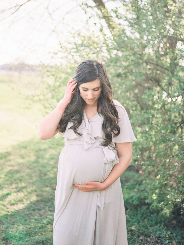 a pregnant woman in a dress