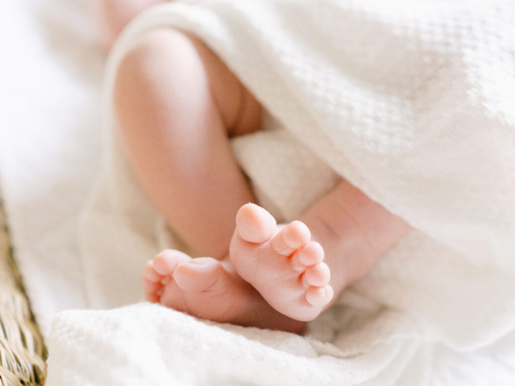 A close up detail photo of newborn baby toes