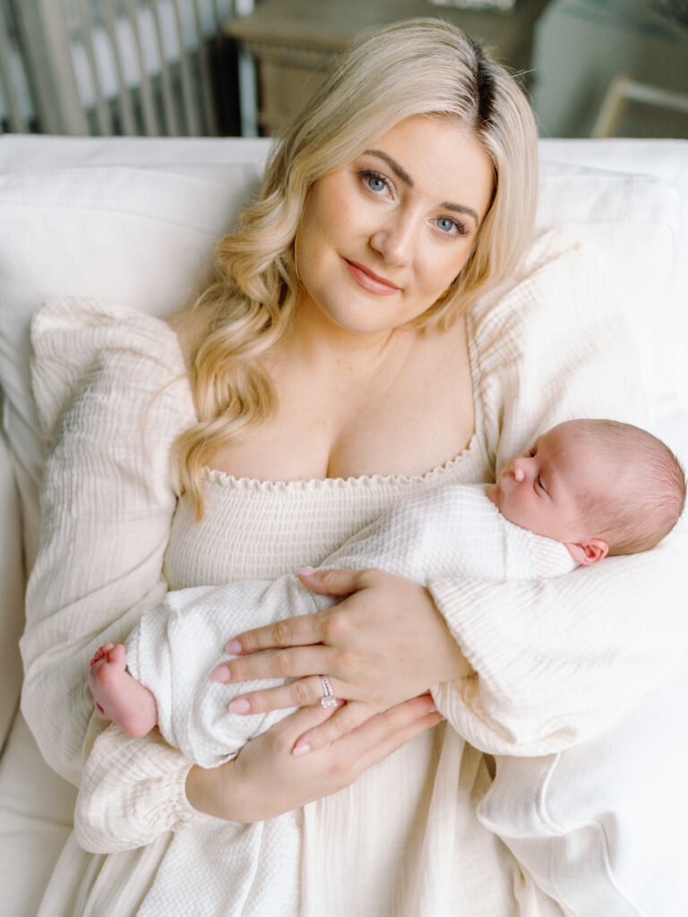 College Grove TN newborn photographer Courtney Houk captures a photo of a first time mom holding her baby boy in her arms