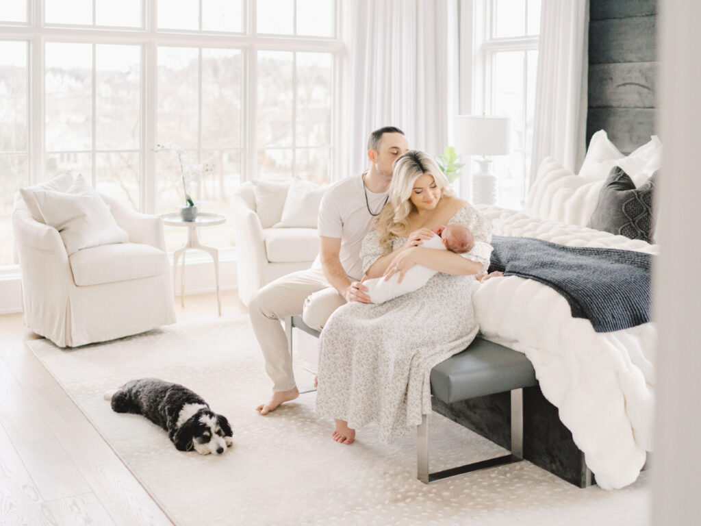 College Grove TN newborn photographer Courtney Houk takes a photo of a mom, dad, newborn, baby boy and their dog in this in-home newborn session