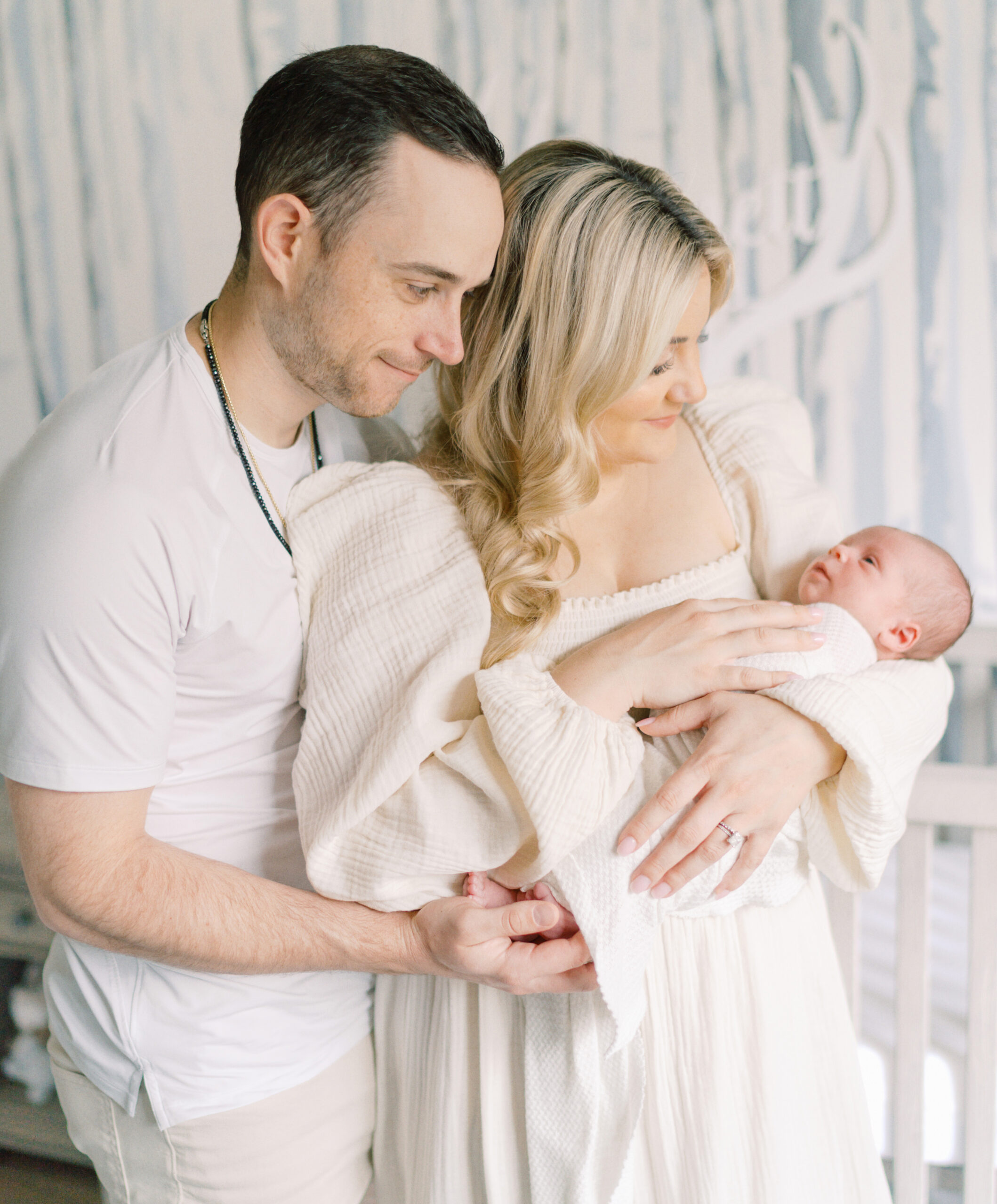 College Grove TN newborn photographer Courtney Houk captures a photo of first time parents with the newborn baby boy